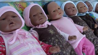 Realistic looking baby dolls.
