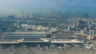 View of Dubai airport with city in background