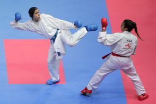 SEPTEMBER 08: Giana Lotfy (blue) of Egypt and Leila Heurtault (red) of France compete in the Womens Kumite -61kg final on day three of the Karate 1 Premier League at Nippon Budokan on September 8, 2019 in Tokyo, Japan.