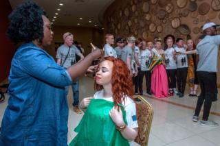 A make-up lady prepares a contestant backstage prior to the first Mister and Miss Albinism Beauty Pageant and Talent Show at the Bingu Conference Centre on September 7, 2019 in Lilongwe